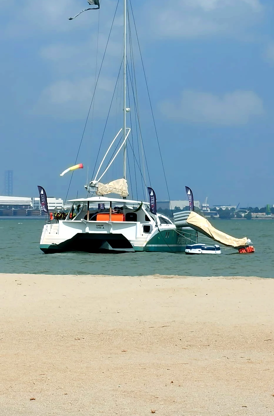 The stern of SeaQuest II near the beach at Forest City
